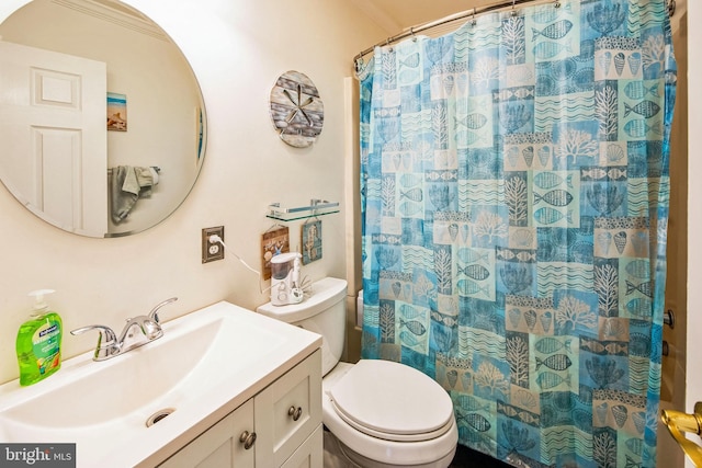 bathroom featuring vanity, toilet, and walk in shower