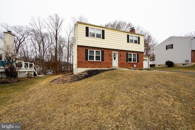 front facade featuring a front yard