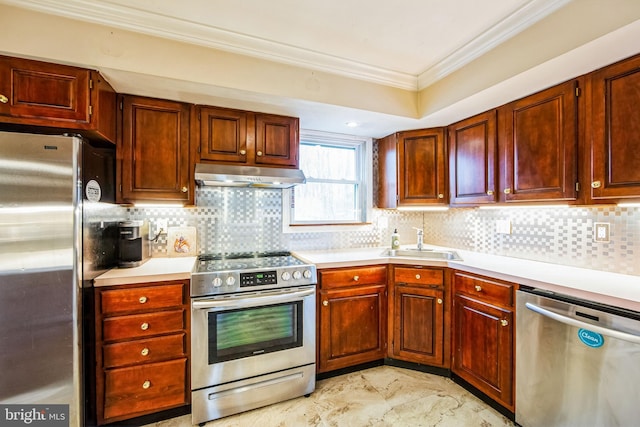 kitchen with stainless steel appliances, crown molding, sink, and backsplash