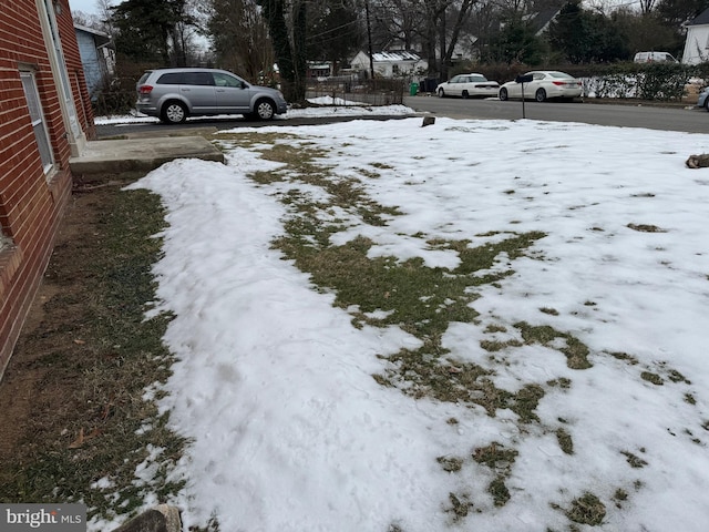 view of yard covered in snow