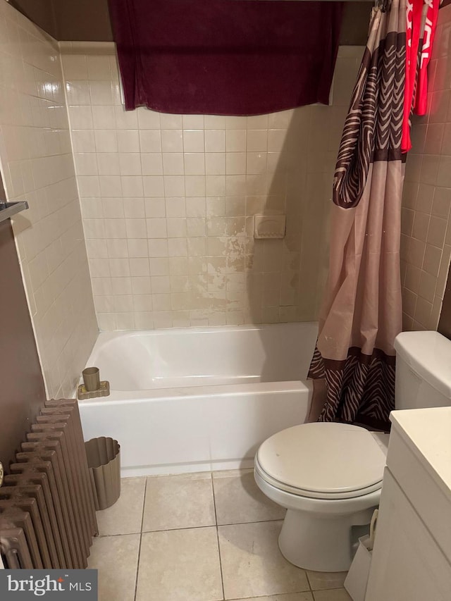 full bathroom featuring tile patterned flooring, vanity, toilet, and shower / bath combo