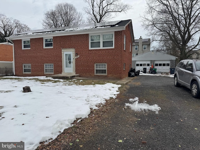 view of front of house with an outbuilding and a garage