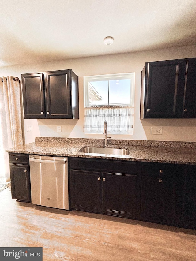 kitchen featuring sink, light hardwood / wood-style floors, and dishwasher