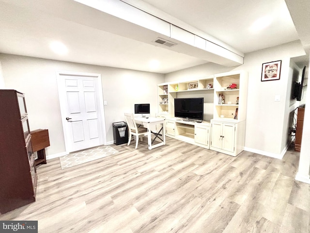 office space with light hardwood / wood-style flooring