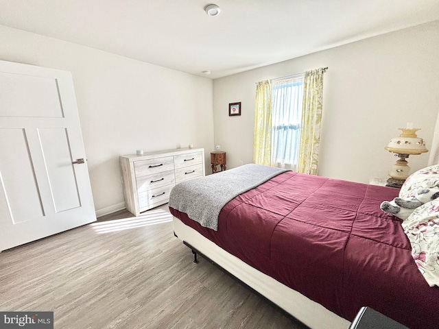 bedroom with light wood-type flooring