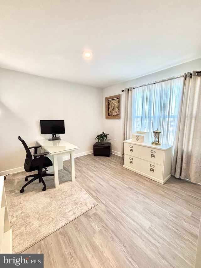 home office featuring light hardwood / wood-style floors