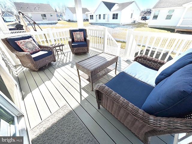 wooden deck with an outdoor hangout area