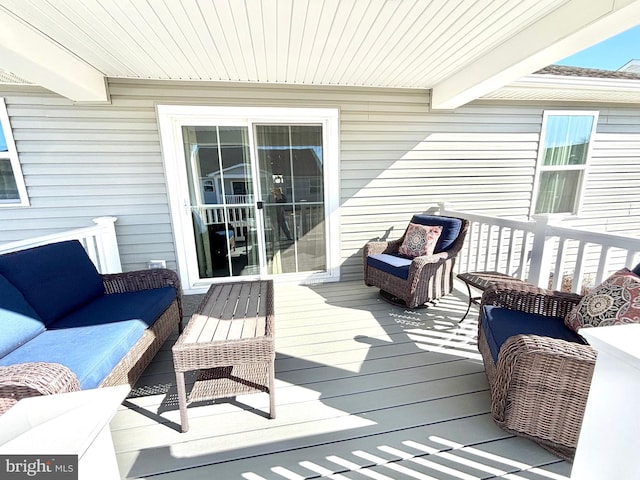 wooden deck with outdoor lounge area