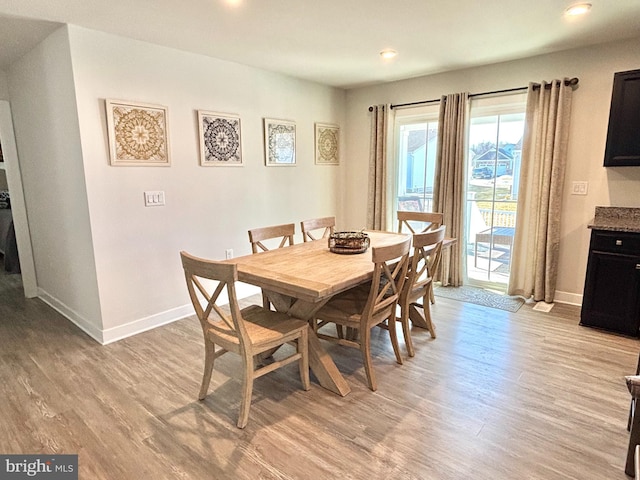 dining area with light wood-type flooring