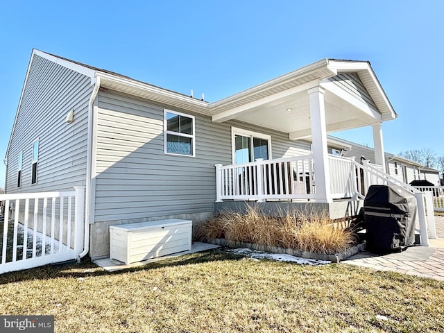 view of property exterior with a yard