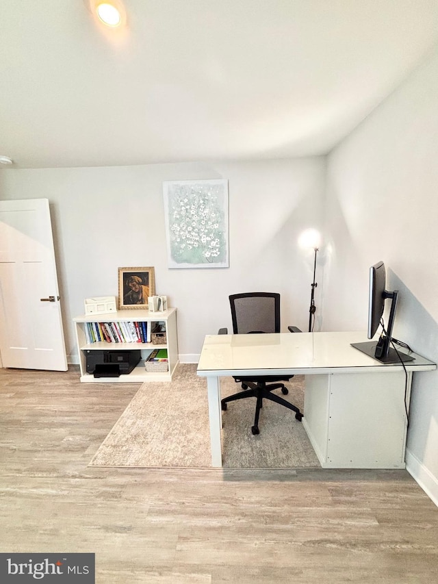 home office with light wood-type flooring