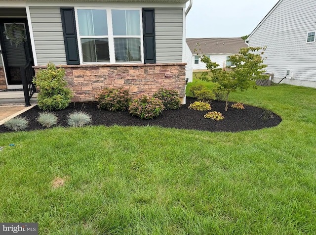 view of property exterior featuring a lawn