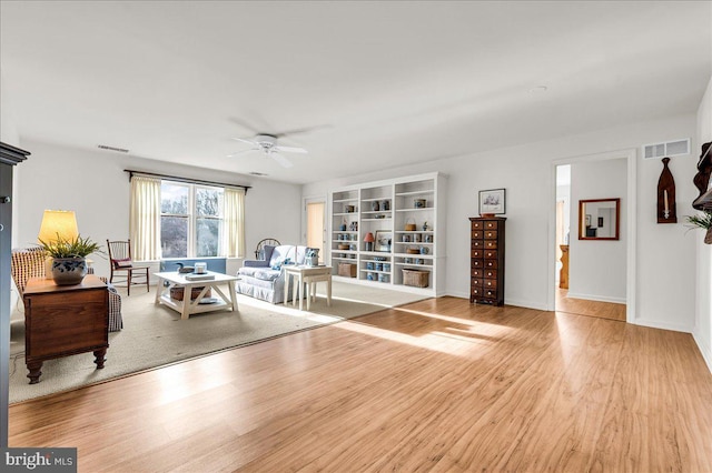 interior space with ceiling fan and light hardwood / wood-style flooring