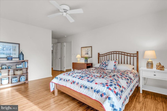 bedroom featuring hardwood / wood-style floors and ceiling fan