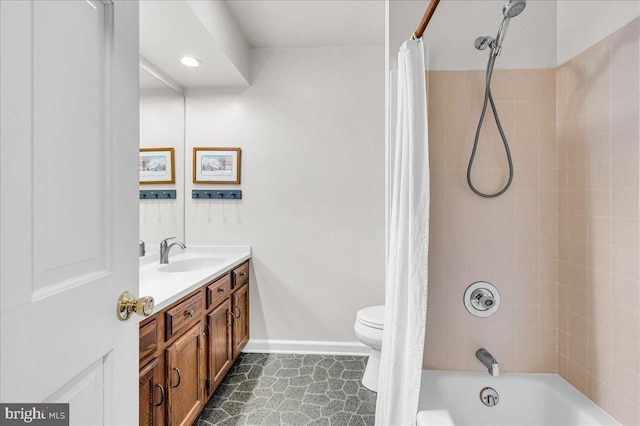 full bathroom with vanity, shower / tub combo, and toilet