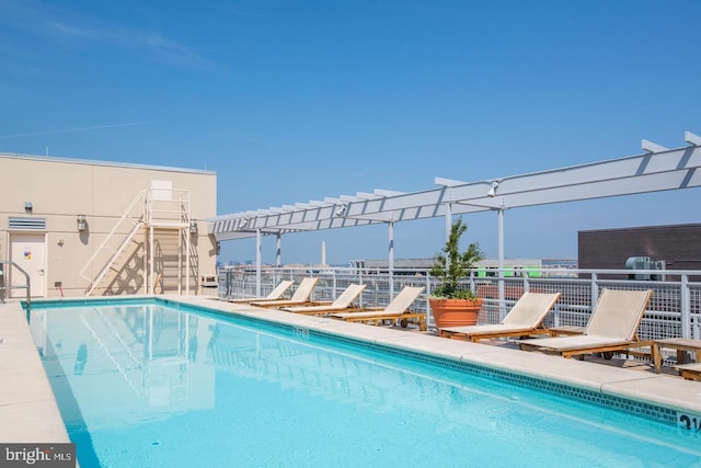 view of swimming pool featuring a pergola