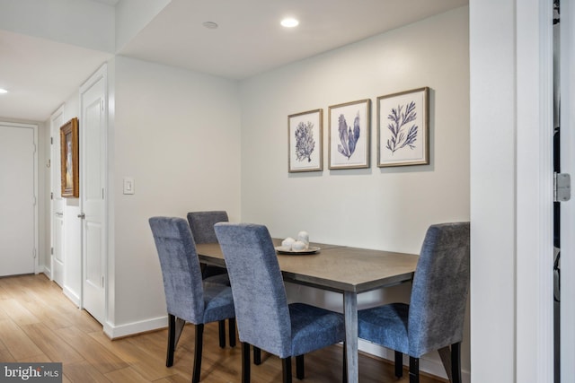 dining space featuring hardwood / wood-style flooring