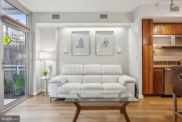 living room with light hardwood / wood-style flooring