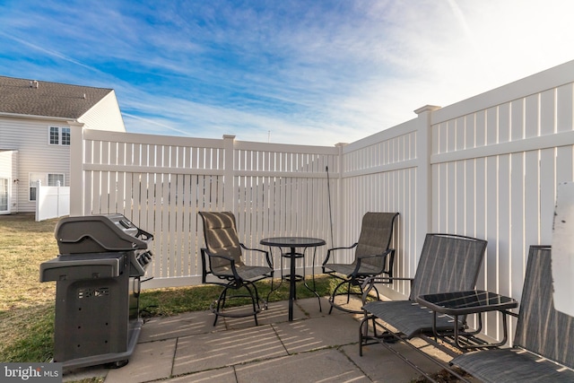 view of patio with a grill