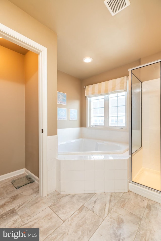 bathroom with tiled tub