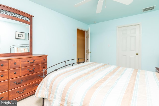 bedroom with ceiling fan and carpet