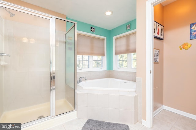 bathroom featuring shower with separate bathtub and tile patterned flooring