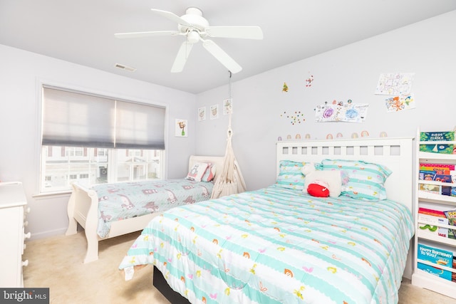 bedroom featuring light carpet and ceiling fan