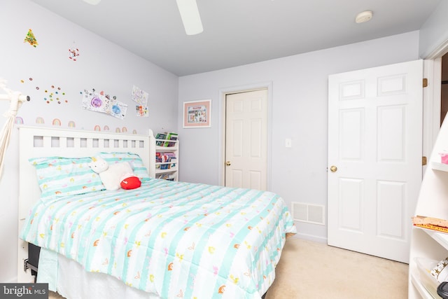 carpeted bedroom featuring ceiling fan