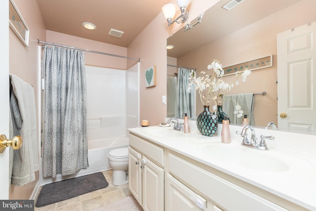 full bathroom featuring vanity, shower / tub combo with curtain, and toilet