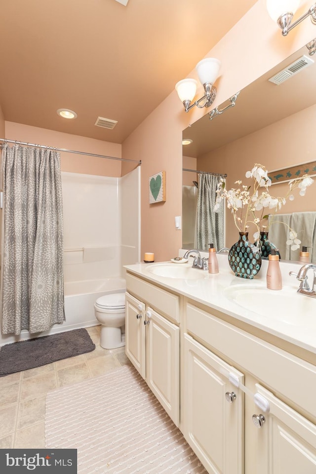 full bathroom featuring vanity, shower / tub combo with curtain, and toilet