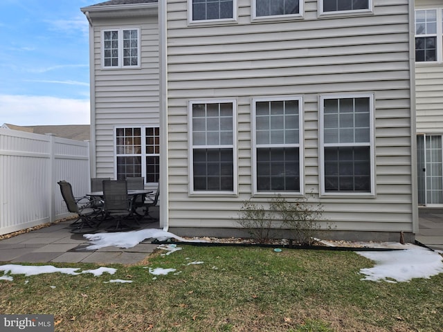 view of home's exterior featuring a patio area and a lawn