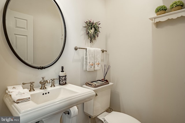 bathroom with sink and toilet