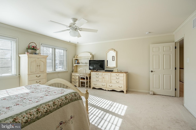 carpeted bedroom with crown molding, ceiling fan, and multiple windows