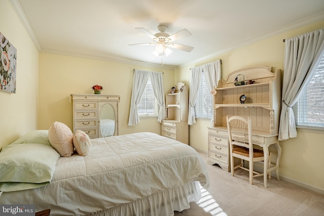 bedroom with ornamental molding, light colored carpet, and ceiling fan