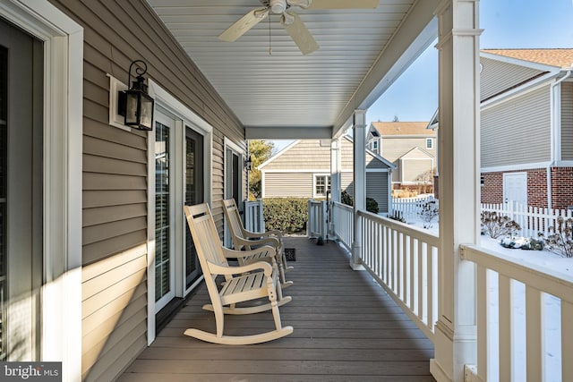 deck with ceiling fan and a porch