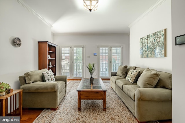 living room with ornamental molding and light wood-type flooring