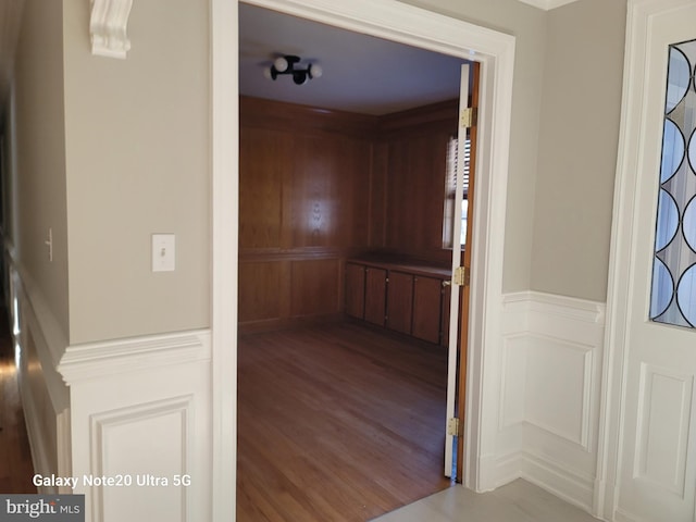 corridor with wood-type flooring