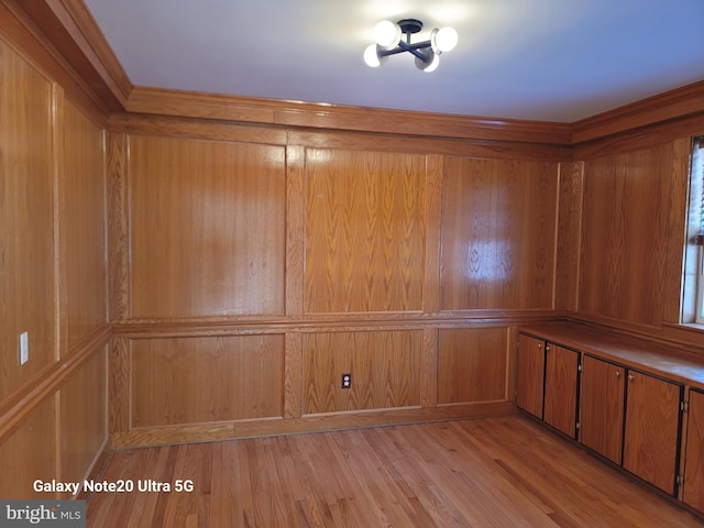 spare room with light hardwood / wood-style flooring