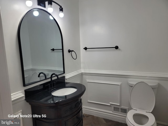 bathroom with vanity and toilet