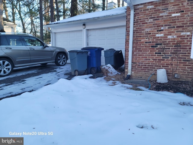 view of snow covered garage