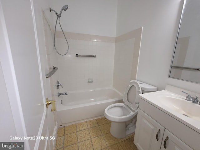 full bathroom featuring vanity, toilet, and tiled shower / bath