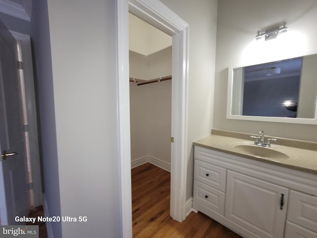 bathroom featuring vanity and wood-type flooring