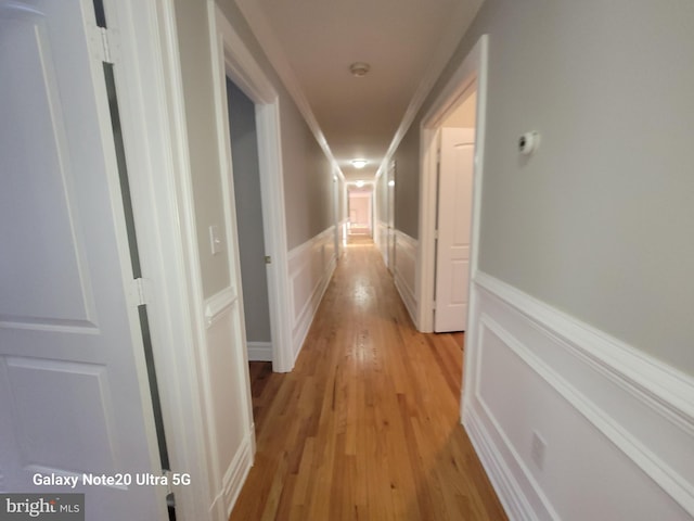 hall with light hardwood / wood-style floors