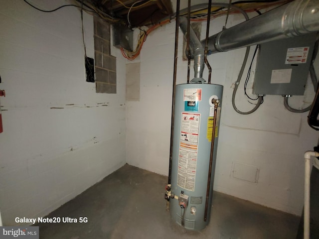 utility room with gas water heater