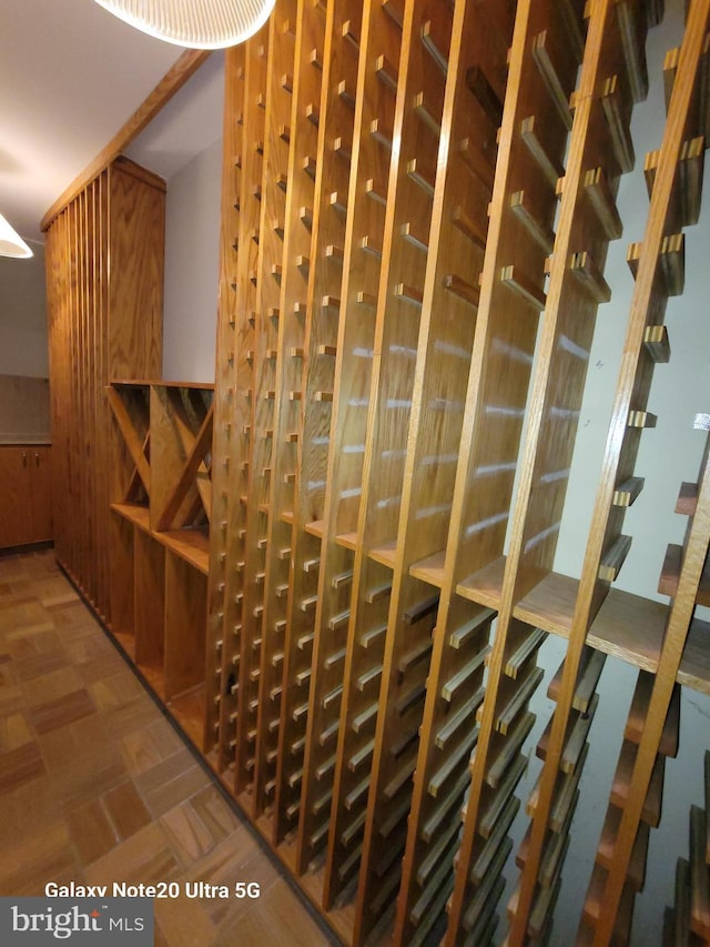 wine room featuring parquet floors