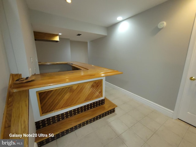 bar featuring light tile patterned flooring