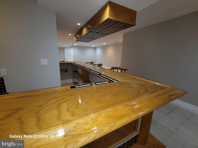 bar featuring light tile patterned floors