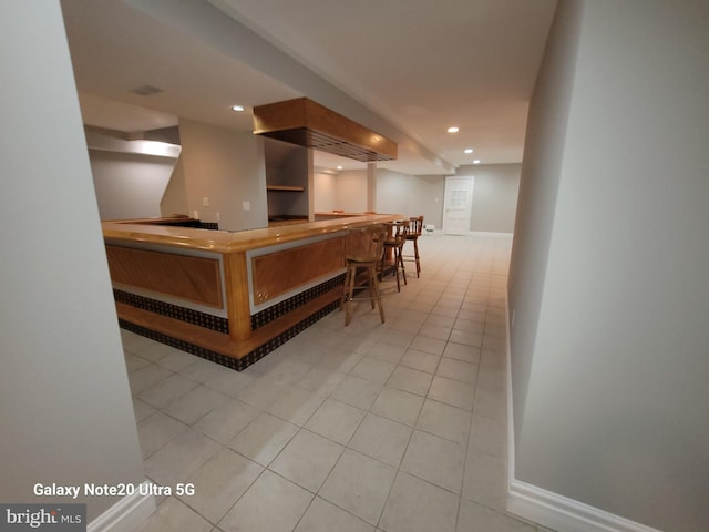 bar with light tile patterned floors