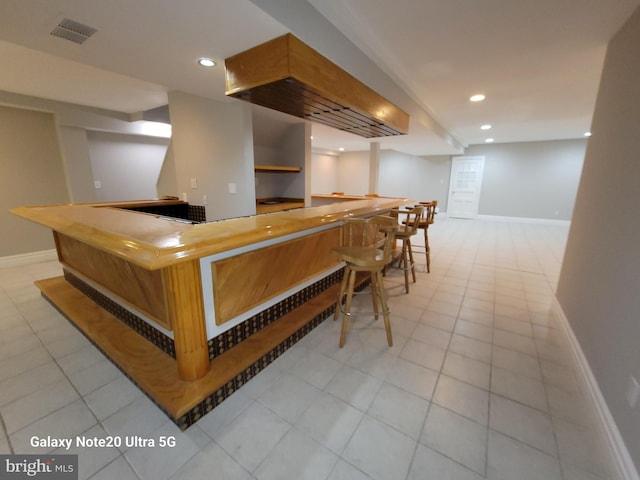 bar with light tile patterned floors