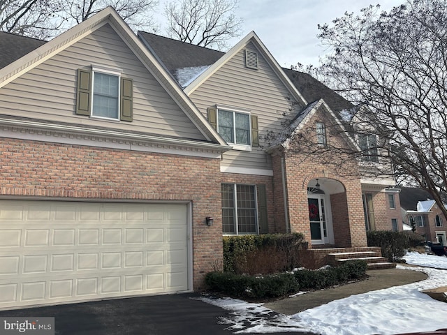 view of front of property with a garage